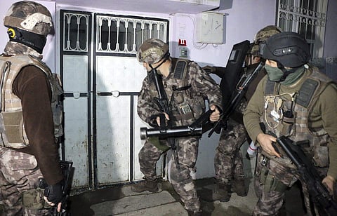 Turkish anti-terrorism police break a door during an operation to arrest people over alleged links to the Islamic State group, in Adiyaman, southeastern Turkey, early Sunday, Feb 5, 2017.(Photo | AP)