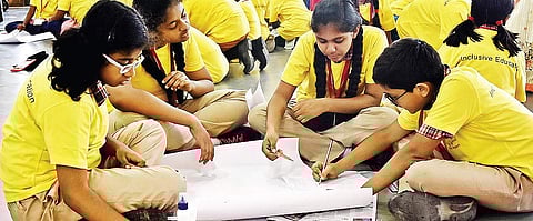 Kids participating in a drawing competition at Vidhya Sagar School