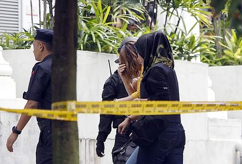 A female suspect, center, accused of murdering Kim Jong Nam is escorted to the Sepang court in Sepang, Malaysia, on March 1. (Photo | AP)
