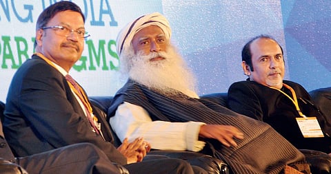 Isha Foundation founder Sadhguru Jaggi Vasudev with Canara Bank chairman T N Manoharan and KMA president Mathew Urumbath at the inaugural session of KMA’s 36th Annual National Management Convention in Kochi on Thursday | Express