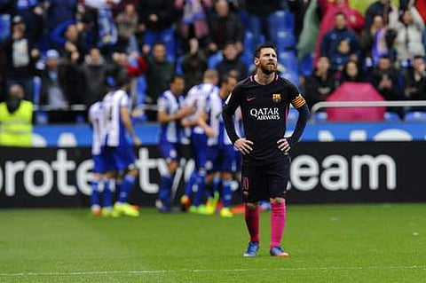 Barcelona's Lionel Messi reacts as Deportivo's players celebrate during a Spanish La Liga soccer match between Deportivo and Barcelona at the Riazor stadium in A Coruna, Spain, Sunday, March 12, 2017.(Photo | AP)