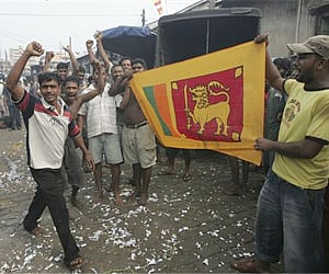 Sri Lankans display the national flag and set off celebratory fireworks after the victory over the LTTE in Colombo. (File photo | AP)