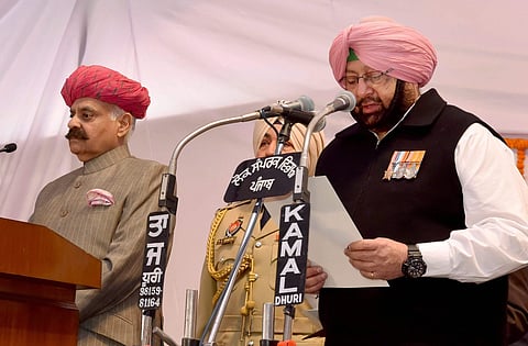 Punjab Governor V P Singh Badnore administering oath to the new Punjab Chief Minister Amarinder Singh at the Raj Bhavan in Chandigarh on Thursday. | PTI