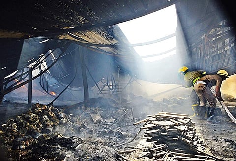 Fire fighters dousing the massive fire that occurred at a home appliances godown | shiba Prasad Sahu