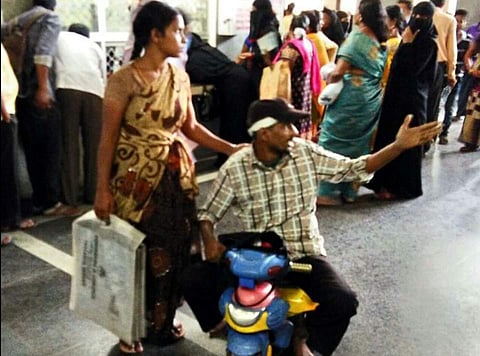 Raju on the tricycle in Telangana hospital. (Photo | EPS)