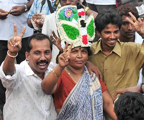 File Photo: An AIADMK supporter wearing a decorated crown with the party symbol | (Express)