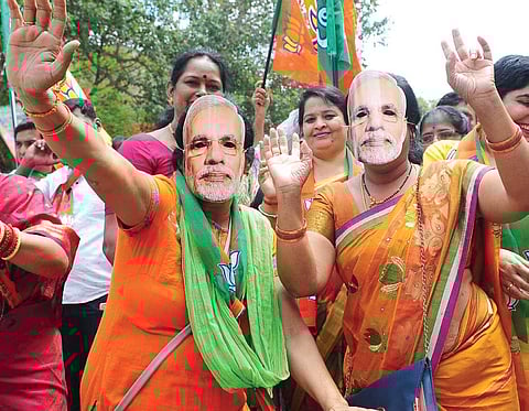 BJP supporters in Bengaluru celebrate the party’s Assembly election victory. | File Photo