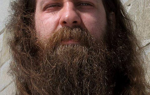 ryan Sturge shows off his beard, in Montpelier, Vt., that he has entered into the 'Vermont Beardies' competition. Sturge says he grew his beard to honor his daughter who died of cancer in 2013 before her Make-a-Wish request to go to Disney World and swim 