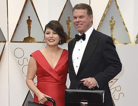 Martha L. Ruiz, left, and Brian Cullinan from PricewaterhouseCoopers at the Oscars in Los Angeles. Film academy president Cheryl Boone Isaacs says the two accountants responsible for the best picture mistake will not work the Oscars again. (File Photo | A