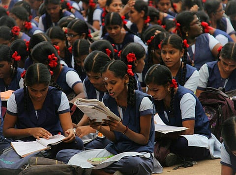 Students making last minute preparations before the board exams at an exam center in Madurai. (K K Sundar | EPS)
