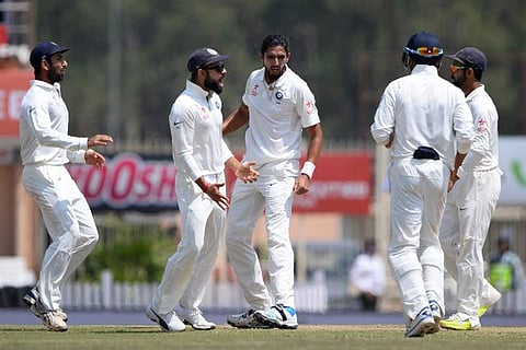 Indian bowler Ishant Sharma (3rd L) celebrates with captain Kohli (2nd R) after he dismissed Australian batsman Matthew Renshaw during the fifth day of the third cricket Test match between India and Australia, March 20, 2017 (Photo | AFP)