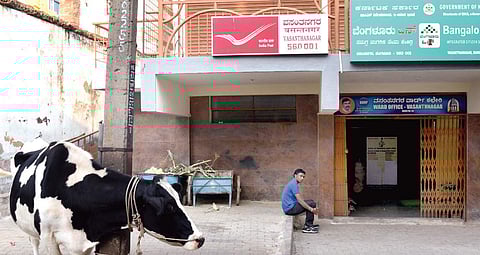(Above) The new post office in BBMP complex and (right) shops where the old one stood still carry the older pincode 560052  Vinod Kumar T