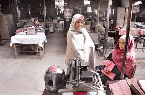 A scene outside a district court in Delhi; a typewriter making unit in 1984;