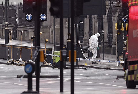 A forensic officer works near the Houses of Parliament in London, Britain, the day after a terrorist attack. (Photo | AP)