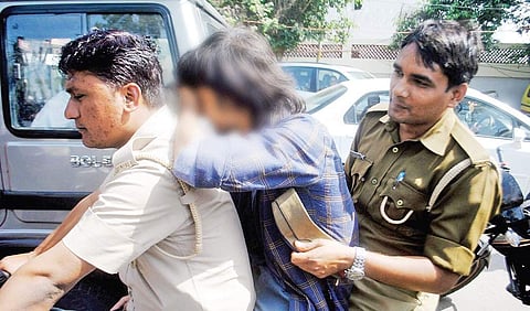 The ‘Anti-Romeo Squad’ of Uttar Pradesh police take a youth into custody for  eve-teasing, in Lucknow on Wednesday | pTI