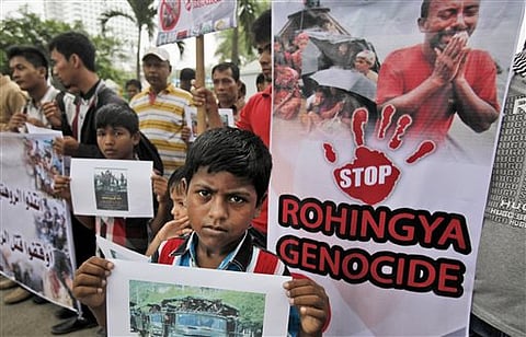 Ethnic Rohingya migrants hold banners during a rally in Indonesia. (File photo |AP)