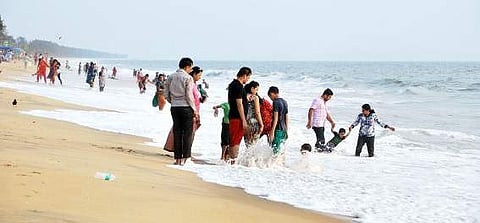 Tourists enjoy the waves at Cherai Beach    K Shijith