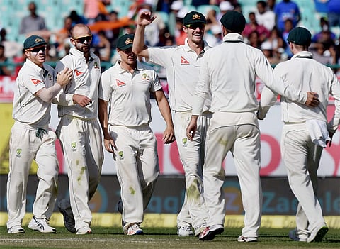 Australian spinner Nathan Lyon celebrates the wicket of India's Ajinkya Rahane during the second day of last Test match at HPCA Stadium in Dharamshala on Sunday. | PTI