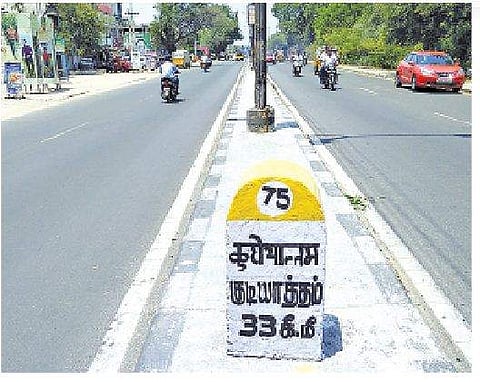 A milestone reads Gudiyattam in Hindi and Tamil. Freshly painted, the place name in English made way for Tamil | S Dinesh