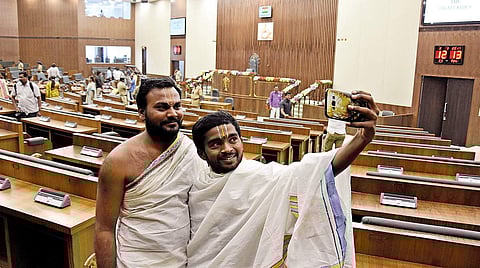 Priests taking a selfie during the inauguration of AP Assembly building at the Interim Government Complex in Velagapudi in Guntur district on Thursday | Express Photo