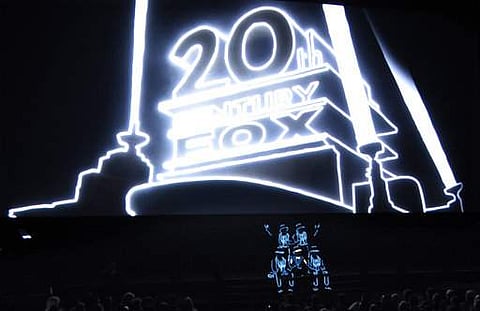 Illuminated performers pose onstage at the start of 20th Century Fox's presentation at CinemaCon 2017 at Caesars Palace on March 30 in Las Vegas.  (Photo | AP)
