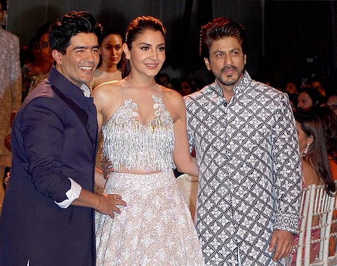 Shah Rukh Khan and Anushka Sharma along with fashion designer Manish Malhotra at Mijwan Summer 2017 fashion show. (File Photo | PTI)