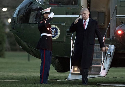 President Donald Trump salutes as he disembarks Marine One upon arrival at the White House, Sunday, March 5, 2017. (Photo | AP)
