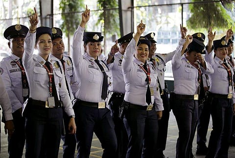 Female security guards in a mass dancing event at the Department of Agrarian Reform to show their declaration against the global problem on violence against women and children in Manila, Philippines on Monday. The mass dancing dubbed as 'One Billion Rising' was held as part of protests leading to March 8 International Women's Day. (Photo | AP)