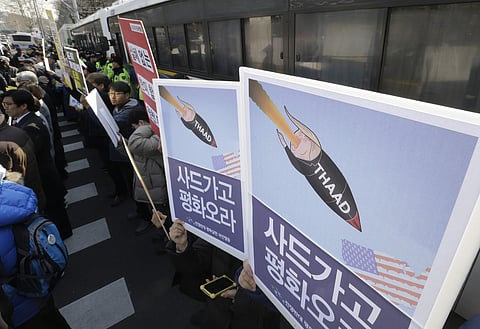 South Korean protesters stage a rally to oppose a plan to deploy an advanced U.S. missile defense system called Terminal High-Altitude Area Defense, or THAAD, in front of the Defense Ministry in Seoul (Photo | AP)