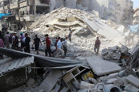 People inspect the damage at a market hit by airstrikes in Aleppo. (File photo| Reuters)