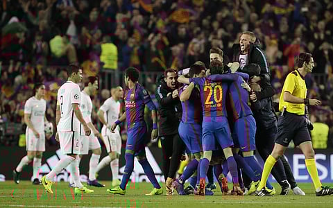 Barcelona players celebrate at the end of the Champions League round of 16. AP