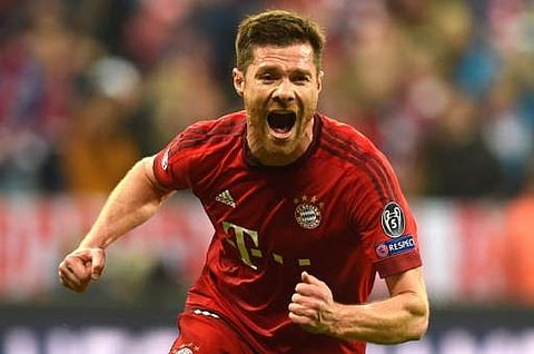 This file photo taken on May 03, 2016 shows Bayern Munich's Spanish midfielder Xabi Alonso celebrating scoring during the UEFA Champions League semi-final, second-leg football match between FC Bayern Munich and Atletico Madrid in Munich, southern Germany.
