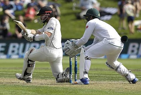 New Zealand's Kane Williamson plays a sweep shot during the first cricket test against South Africa at University Oval, Dunedin, New Zealand. (AP)