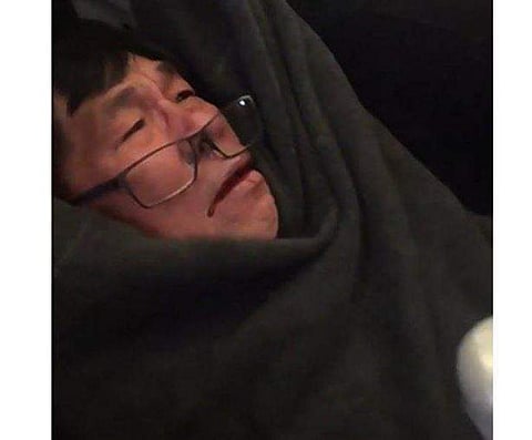 Screen grab of the man being dragged out.