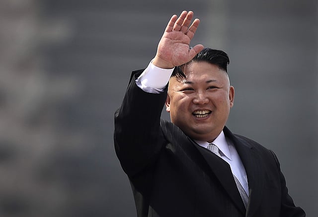 State television showed Kim, wearing a black suit and white shirt, stepping out of a limousine and saluting his honour guard before walking down a red carpet. | AP