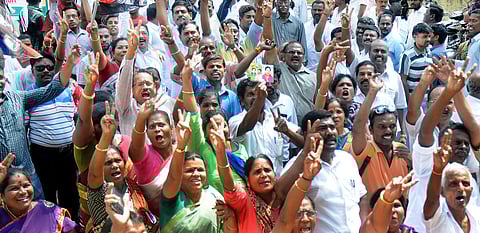 AIADMK cadres showcasing the two leaves symbol. (D Sampath Kumar | EPS)