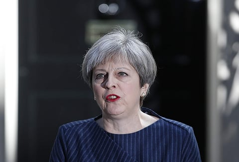 Britain's Prime Minister Theresa May arrives to speak to the media outside her official residence of 10 Downing Street in London, Tuesday April 18, 2017. | AP
