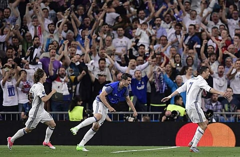Real Madrid's Portuguese forward Cristiano Ronaldo (R) celebrates a goal  | AFP