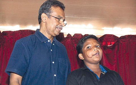 Abhay Kumar with Dr Jayakumar of Lisie Hospital, who led the medical team that reconstructed Abhay’s face, in Kochi on Saturday | Melton Antony