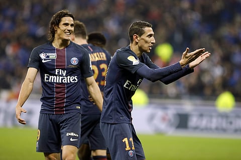 Paris Saint Germain's Angel Di Maria, right, celebrates next to Roberto Edinson Cavani, after he scored a goal against Monaco during their League Cup final soccer match in Decines, near Lyon, central France, Saturday, April 1, 2017. | AP