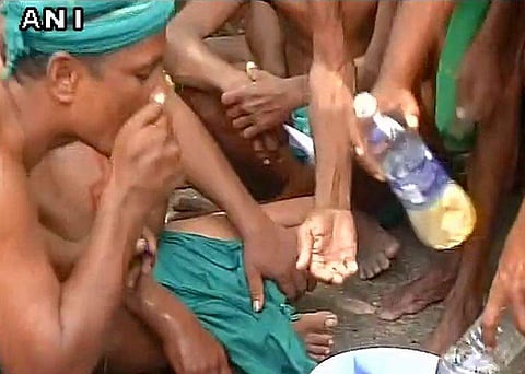 Tamil Nadu farmers drink urine protesting over drought relief funds and waiver of farmers' loans at Delhi's Jantar Mantar. | Picture Courtesy: ANI