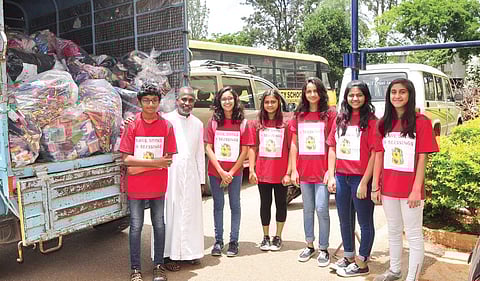 Nikhiya Shamsher and other volunteers with a truckload of reusable stationery items
