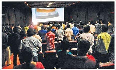 National anthem playing in a movie hall
