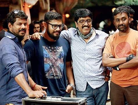 Shameer Mohammed (second from left) with director B Unnikrishnan on the sets of  Mohanlal-starrer VillaIn