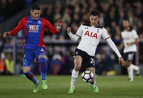 Tottenham's Dele Alli, right, with Crystal Palace's Joel Ward during the English Premier League soccer match between Crystal Palace and Tottenham Hotspur at Selhurst Park stadium in London, Wednesday, April 26, 2017.  | AP