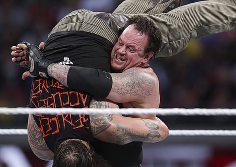 In this March 29, 2015, file photo, Bray Wyatt is upended by his opponent, The Undertaker, at Wrestlemania XXXI in Santa Clara, Calif.  |AP