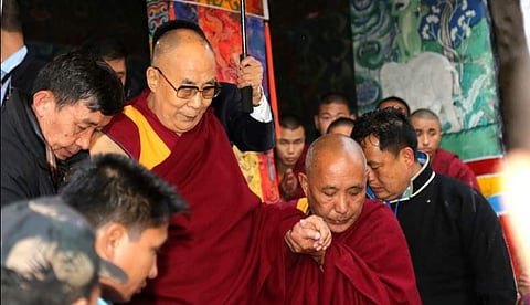 Tibetan spiritual leader Dalai Lama with followers after he made a sudden stop at Bomdila, Arunachal Pradesh on Tuesday evening following rough weather | EPS