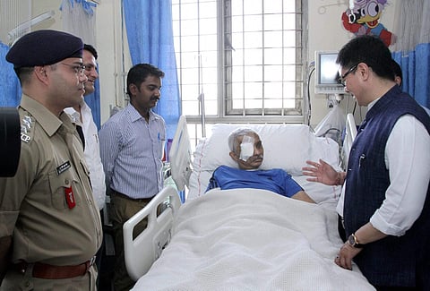 Minister of State for Home Affairs Kiren Rijiju seeing the CRPF Commandant Chetan Kumar Cheetah at AIIMS | PTI