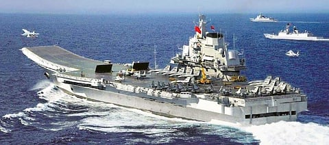 Chinese aircraft carrier Liaoning  berthed at an unnamed port