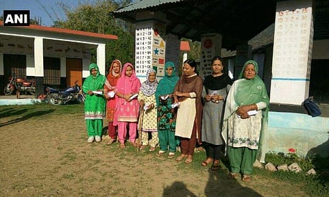 Himachal Pradesh: Polling delayed at Booth no.51 in Bhoranj assembly bypolls (Hamirpur district) due to fault in EVM. | Picture Courtesy: ANI